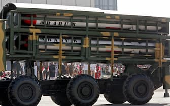 Islamabad, PAKISTAN: Recently tested, longer range versions of the Pakistani nuclear-capable, radar-dodging cruise missile, the Hatf VII Babur missile, are displayed during the parade marking Pakistan Day in Islamabad, 23 March 2007. Pakistan has successfully test fired Babur missile which a range of 700 kilometres (435 miles) and can carry all kinds of warheads including nuclear on 22 March. President Pervez Musharraf pledged to make Pakistan an "impregnable fortress of democracy" amid a crisis over his removal of the country's most senior judge. The President made the comment in a message marking Pakistan Day, which celebrates a resolution signed in 1940 to create a separate homeland for Muslims on the Indian subcontinent.  AFP PHOTO/Aamir QURESHI (Photo credit should read AAMIR QURESHI/AFP via Getty Images)