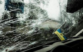 BUCHA, UKRAINE - 2022/04/03: A bullet-riddled car's windshield is seen in Bucha, a suburb north of Kyiv, where the war between Russian Federation forces and the Ukrainian Military took place. As Russian troops withdraw from areas north of Ukraine's capital city of Kyiv, Ukrainian forces and the media found evidence of significant numbers of civilian casualties. The Ukrainian authorities are calling the killing of civilians in Bucha and other areas a war crime. (Photo by Matthew Hatcher/SOPA Images/LightRocket via Getty Images)