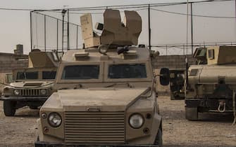 Humvees (High mobility multipurpose wheeled vehicles) and pick-up trucks are parked at the DPK (Democratic Party of Kurdistan) Peshmerga base in Makhmour - 50 km south of Erbil, some 100 km south of Mosul and 50 km north of Kirkuk - was recaptured only days ago by Kurdish Peshmerga fighters.  It is now one of the few places in the Nineveh plains that has successfully pushed back the Islamic State and is holding strong.  Following an ISIS (Islamic State of Iraq and Syria) offensive, the town fell to the Caliphate on the 8th of August.  It was taken back by the Peshmerga and PKK fighters on August 10. Makhmour was emptied of its population who decided to flee to nearby Erbil or the mountains.  It is presently still deserted as only about 10 percent of its population has decided to come back.  Makhmour, IRAQ -18/08/2014 .. /LECAER_1808.028/Credit:Vianney LE CAER / SIPA / 1408190945