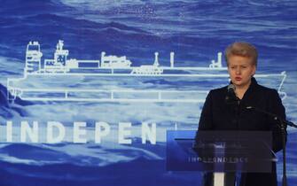 457943752 Lithuanian President Dalia Grybauskaite speaks during a welcoming ceremony for the liquefied natural gas (LNG) vessel "Independence" in Klaipeda on October 27, 2014. The "Independence", a huge floating liquefied natural gas (LNG) terminal docked in the Lithuanian port of Klaipeda on Monday, becoming the first such facility to sever Moscow's energy grip on the Baltic states. AFP PHOTO / PETRAS MALUKAS (Photo credit should read PETRAS MALUKAS/AFP via Getty Images)