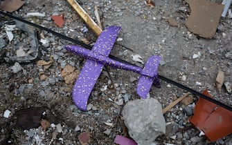 BORODIANKA, UKRAINE - APRIL 05: A toy plane as seen in the rubbles of the residential building on April 5, 2022 in Borodianka, Ukraine.  The Russian retreat from Borodianka and other towns near Kyiv have revealed the extent of devastation from that country's failed attempt to seize the Ukrainian capital.  The Ukrainian government expects a renewed battle in the east, after Russia largely withdrew its forces from around Kyiv.  (Photo by Anastasia Vlasova / Getty Images)