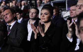 Russian politician and former Olympic Champion Alina Kabaeva (C)  applauds as  Prime Minister Vladimir Putin  speeches (unseen) during  the congress of the United Russia Party in Moscow, Russia, November,27, 2011. Photo by Sasha Mordovets/Getty Images