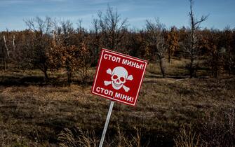 STANYTSIA LUHANSKA, UKRAINE - NOVEMBER 2: A landmine warning sign in front of forested land on the border of the LNR (Luhansk People's Republic) and Ukrainian government controlled territory on November 2, 2018 in Stanytsia Luhanska, Ukraine. The people of east Ukraine have now lived through four years of conflict with no resolution in sight. (Photo by Martyn Aim/Corbis via Getty Images)