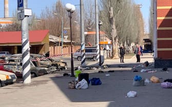 This general view shows personal belongings of victims and burnt-out vehicles after a rocket attack on the railway station in the eastern city of Kramatorsk, in the Donbass region on April 8, 2022. - More than 30 people were killed and over 100 injured in a rocket attack on a train station in Kramatorsk in eastern Ukraine, the head of the national railway company said.  (Photo by Hervé BAR / AFP) (Photo by HERVE BAR / AFP via Getty Images)