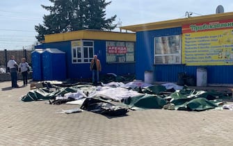 Casualties are laid out next to a platform after a bombing of the railway station in the eastern city of Kramatorsk, in the Donbass region on April 8, 2022. - More than 30 people were killed and over 100 injured in a rocket attack on a train station in Kramatorsk in eastern Ukraine, the head of the national railway company said. (Photo by Hervé BAR / AFP) (Photo by HERVE BAR/AFP via Getty Images)