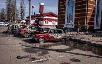 Calcinated cars are pictured outside a train station in Kramatorsk, eastern Ukraine, that was being used for civilian evacuations, after it was hit by a rocket attack killing at least 35 people, on April 8, 2022. (Photo by FADEL SENNA / AFP) (Photo by FADEL SENNA / AFP via Getty Images)