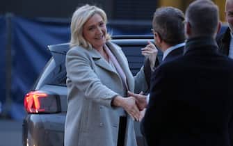 France's far-right party Rassemblement National (RN) candidate for the 2022 French presidential election Marine Le Pen 
arrives for the show "La France face a la guerre" (France in the Face of War) broadcasted on French TV channel TF1, in Saint-Denis, north of Paris, on March 14, 2022.