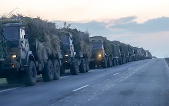 ROSTOV, RUSSIA - FEBRUARY 23: A convoy of Russian military vehicles is seen as the vehicles move towards border in Donbas region of eastern Ukraine on February 23, 2022 in Russian border city Rostov. (Photo by Stringer/Anadolu Agency via Getty Images)