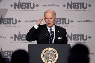 WASHINGTON, DC - APRIL 6:  U.S. President Joe Biden salutes the audience as he finishes speaking during the annual North Americas Building Trades Unions Legislative Conference at the Washington Hilton Hotel on April 6, 2022 in Washington, DC. North Americas Building Trades Unions is a labor organization representing more than 3 million skilled craft professionals in the United States and Canada. (Photo by Drew Angerer/Getty Images)