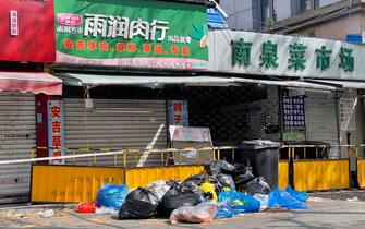 SHANGHAI, CHINA - APRIL 9, 2022 - Garbage piles at the entrance of a closed vegetable farm in Pudong, Shanghai, China, On April 9, 2022. Shanghai is under lockdown. (Photo credit should read Costfoto/Future Publishing via Getty Images)