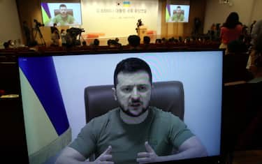 epa09884170 Ukrainian President Volodymyr Zelensky (on screen) addresses the National Assembly via video link to Seoul, South Korea, 11 April 2022. Zelensky asked South Korea to provide military hardware support to help his country fight against the Russian aggression.  EPA/YONHAP / POOL SOUTH KOREA OUT