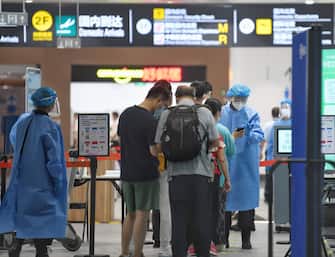 Beijing Daxing International Airport, staff wipe disinfection self-service check-in counters, in North China's Beijing, 12 August 2021.  (Photo by ChinaImages/Sipa USA)