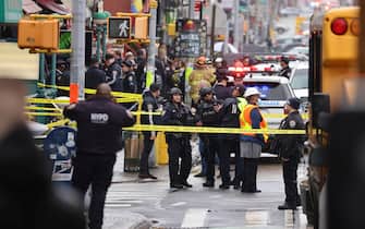 New York City Police and Fire Department officials on the scene of a reported multiple shooting at a New York City Subway station in the Brooklyn borough of New York, New York, USA, 12 April 2022.  ANSA/JUSTIN LANE