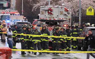 epa09885985 New York City Police and Fire Department officials on the scene of a reported multiple shooting at a New York City Subway station in the Brooklyn borough of New York, New York, USA, 12 April 2022. EPA / JUSTIN LANE