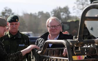 epa09887499 Swedish Minister of Defense Peter Hultqvist looks at a Finnish/Latvian Patria 6x6 vehicle during his visit to Adazi military base, Latvia, 13 April 2022. Peter Hultqvist pays a visit to Latvia to discuss regional security issues, including Russia's extended war in Ukraine and support measures for Ukraine. During his visit to Adazi base, he got acquainted with the work of the National Armed Forces Mechanized Infantry Brigade and the NATO Multinational Battle Group based in Latvia followed by demonstrations of the Finnish/Latvian Patria 6x6 vehicle. Swedish Ministry of Defense has officially expressed interest in joining the Patria 6x6 armored vehicle project. There is the possibility of the traditionally neutral Sweden moving towards NATO membership.  EPA/TOMS KALNINS