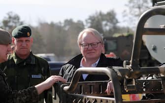 LATVIA SWEDEN DEFENSE epa09887499 Swedish Minister of Defense Peter Hultqvist looks at a Finnish/Latvian Patria 6x6 vehicle during his visit to Adazi military base, Latvia, 13 April 2022. Peter Hultqvist pays a visit to Latvia to discuss regional security issues, including Russia's extended war in Ukraine and support measures for Ukraine. During his visit to Adazi base, he got acquainted with the work of the National Armed Forces Mechanized Infantry Brigade and the NATO Multinational Battle Group based in Latvia followed by demonstrations of the Finnish/Latvian Patria 6x6 vehicle. Swedish Ministry of Defense has officially expressed interest in joining the Patria 6x6 armored vehicle project. There is the possibility of the traditionally neutral Sweden moving towards NATO membership. EPA/TOMS KALNINS