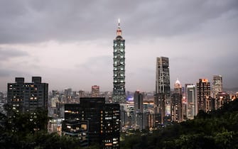 The Taipei 101 building and other buildings are illuminated at dusk in Taipei, Taiwan, on Tuesday, Jan. 26, 2021. Taiwan is scheduled to release gross domestic product (GDP) figures on Jan. 29. Photographer: I-Hwa Cheng / Bloomberg