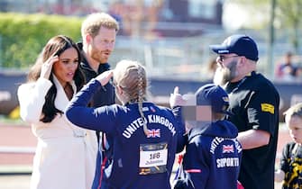The Duke and Duchess of Sussex greet competitors and supporters from the United Kingdom team at the Invictus Games athletics events in the Athletics Park, at Zuiderpark the Hague, Netherlands. Picture date: Sunday April 17, 2022. (Photo by Aaron Chown/PA Images via Getty Images)