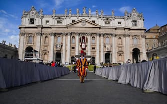 A Swiss Guard stands by St. Peter's Basilica prior to the Pope's Easter mass on April 17, 2022 at St. Peter's square in The Vatican. (Photo by Tiziana FABI / AFP) (Photo by TIZIANA FABI/AFP via Getty Images)