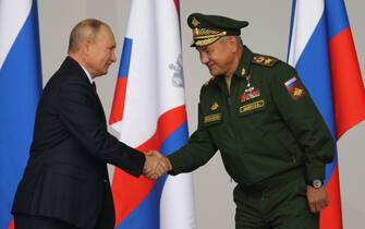 KUBINKA, RUSSIA - AUGUST,23 (RUSSIA OUT): Russian President Vladimir Putin (L) and Defence Minister Sergei Shoigu (R) attend the opening ceremony of the International Military-Technical Forum "Army-2021" at the Partiot Park, on August,23,2021, in Kubinka, outside of Moscow, Russia. President Putin arrived to the Patriot Park to visit an anuual national military forum and exhibition. (Photo by Mikhail Svetlov/Getty Images)