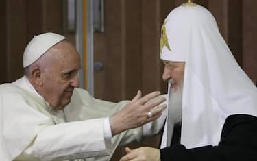 epa05157383 Pope Francis (L) embraces Russian Orthodox Patriarch Kirill (R) at the Jose Marti Airport in Havana, Cuba, 12 February 2016. Pope Francis and the leader of the Russian Orthodox Church, Patriarch Kirill, held a historic meeting in Havana's international airport. The two leaders signed a memorandum, which focused on ecumenism, or efforts to reunite Christian churches, common Christian values, and the persecution of Christians in the Middle East and Africa.  EPA/Alejandro Ernesto / POOL