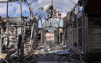 epa09901554 Damaged market's pavilions after shelling in Kharkiv, Ukraine, 21 April 2022. The city of Kharkiv, Ukraine's second-largest, has witnessed repeated airstrikes from Russian forces. Russian troops entered Ukraine on 24 February resulting in fighting and destruction in the country and triggering a series of severe economic sanctions on Russia by Western countries.  EPA/VASILIY ZHLOBSKY