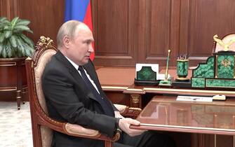 April 21, 2022. - Russia, Moscow. - Russian President Vladimir Putin during a meeting with Russian Defence Minister Sergey Shoigu in the Kremlin. Shoigu reported about Russian troops and the DPR People's Militia taking control of the city of Mariupol.