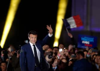 epa09907382 French President Emmanuel Macron arrives to deliver a speech after winning the second round of the French presidential elections at the Champs-de-Mars after Emmanuel Macron won the second round of the French presidential elections in Paris, France, 24 April 2022. Emmanuel Macron defeated Marine Le Pen in the final round of France's presidential election, with exit polls indicating that Macron is leading with approximately 58 percent of the vote.  EPA/GUILLAUME HORCAJUELO
