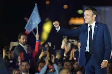 French President and La Republique en Marche (LREM) party candidate for re-election Emmanuel Macron celebrates after his victory in France's presidential election, at the Champ de Mars in Paris, on April 24, 2022. (Photo by bERTRAND GUAY / AFP) (Photo by BERTRAND GUAY/AFP via Getty Images)