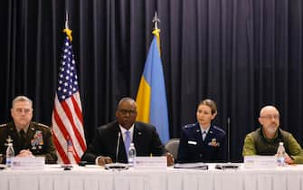 epa09909475 U.S. Secretary of Defense Lloyd J. Austin III (2-L) speaks in the presence of Ukrainian Defense Minister Oleksii Reznikov (R) and US Chairman of the Joint Chiefs of Staff, general Mark Milley (L) during a meeting of Ministers of Defense at the US Air Base in Ramstein, Germany, 26 April 2022. The U.S. Secretary of Defense Austin has invited Ministers of Defense and senior military officials from around the world to Ramstein to discuss the ongoing crisis in Ukraine and various security issues facing U.S. allies and partners.  EPA/RONALD WITTEK