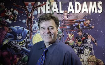 FOR USE WITH STORY by Luis Torres de la Llosa, US-ART-COMICS-FASHION-SUPERHEROES Neal Adams poses in his office at Continuity Studios in New York on April 14, 2008. Adams is creating nine new issues of Batmn for DC Comics. AFP PHOTO/Nicholas ROBERTS (Photo credit should read NICHOLAS ROBERTS/AFP via Getty Images)