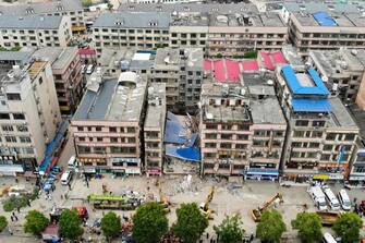 This aerial photograph taken on April 29, 2022 shows rescuers working after a six-storey building collapsed in Changsha, in China's central Hunan province. - China OUT (Photo by CNS / AFP) / China OUT (Photo by -/CNS/AFP via Getty Images)