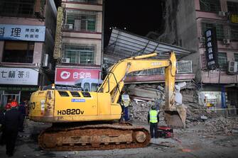 CHANGSHA, CHINA - APRIL 29: An excavator works at the collapse site of a self-constructed residential building on April 29, 2022 in Changsha, Hunan Province of China. The incident took place on Friday in Wangcheng District in Changsha. (Photo by Yang Huafeng/China News Service via Getty Images)
