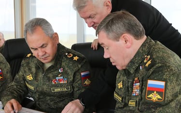 epa09152916 A handout photo made available by the press service of the Russian Defence Ministry shows Russian Defense Minister Army General Sergei Shoigu (L) and Chief of the Russian General Staff Valery Gerasimov (R) attend the main stage of the mixed exercise of the Russian Armed Forces at the at Opuk range  in Crimea, 22 April 2021. Units of the combined arms army, air force and air defen e formations, warships and ships, military units of the coastal forces of the Black Sea Fleet, part of the forces of the Caspian Flotilla and airborne units take part in the military exercises at the Opuk training ground.  EPA/VADIM SAVITSKY / RUSSIAN DEFENCE MINISTRY / HANDOUT MANDATORY CREDIT / HANDOUT EDITORIAL USE ONLY/NO SALES