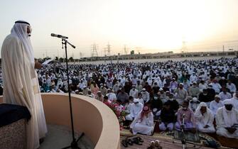 epa09921958 Emirate cleric Aref Sheikh (L) leads the Eid Al-Fitr prayer at Nad Al Hammar Eid Musalla in Dubai, United Arab Emirates, 02 May 2022. Muslims around the world celebrate Eid al-Fitr, the three days festival marking the end of Ramadan. Eid al-Fitr is one of the two major holidays in the Islamic calendar.  EPA/ALI HAIDER