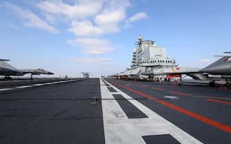 This photo taken on December 23, 2016 shows Chinese J-15 fighter jets on the deck of the Liaoning aircraft carrier during military drills in the Yellow Sea, off China's east coast.  Taiwan's defense minister warned on December 27 that enemy threats were growing daily after China's aircraft carrier and a flotilla of other warships passed south of the island in an exercise as tensions rise.  / AFP / STR / China OUT (Photo credit should read STR / AFP via Getty Images)