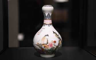 PARIS, FRANCE - SEPTEMBER 22: A vase with birds and flowers, Qing dynasty (1644-1911), Qianlong period (1736-95), is on display during an exhibition titled 'From Afar: Travelling Materials and Objects' at The Louvre Museum on September 22, 2021 in Paris, France. (Photo by Li Yang/China News Service via Getty Images)