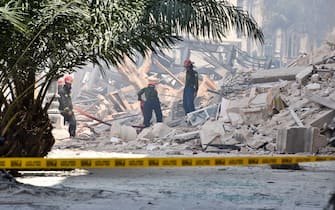 Rescuers work after an explosion in the Saratoga Hotel in Havana, on May 6, 2022. - A powerful explosion Friday destroyed part of a hotel under repair in central Havana, AFP witnessed, with no casualties immediately reported. (Photo by ADALBERTO ROQUE / AFP) (Photo by ADALBERTO ROQUE/AFP via Getty Images)