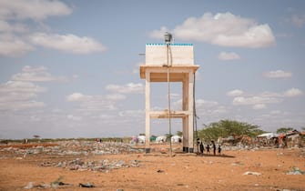 DOLLOW, JUBALAND, SOMALIA - 2022/04/13: A water tank at a camp on the outskirts of Dollow, where people displaced by the ongoing drought have gathered. People from across Gedo in Somalia have been displaced due to drought conditions and forced to come to Dollow, in the southwest, to search for aid. Somalia has suffered three failed rainy seasons in a row, making this the worst drought in decades, and 6 million people are in crisis levels of food insecurity. The problems are being compounded by the rising costs of food prices because of the Ukraine war. Hence, hundreds of thousands of livestock have died from hunger and thirst. (Photo by Sally Hayden/SOPA Images/LightRocket via Getty Images)