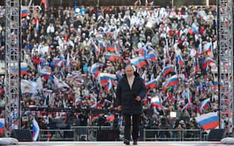 Russian President Vladimir Putin attends a concert marking the eighth anniversary of Russia's annexation of Crimea at the Luzhniki stadium in Moscow on March 18, 2022. (Photo by Mikhail KLIMENTYEV / SPUTNIK / AFP) (Photo by MIKHAIL KLIMENTYEV/SPUTNIK/AFP via Getty Images)