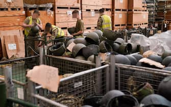 Members of the military pack thousands of surplus helmets donated by the army for 'Hats off to Ukraine', at MOD Donnington in Shropshire. Thirty members of the Midlands' based "Poachers", from 2nd Battalion The Royal Anglian Regiment, have sorted and packed 84,000 surplus helmets bound for the Ukrainian military in just two weeks, and are now in the final push to pack up all the helmets by Friday. Picture date: Thursday March 31, 2022. (Photo by Jacob King/PA Images via Getty Images)