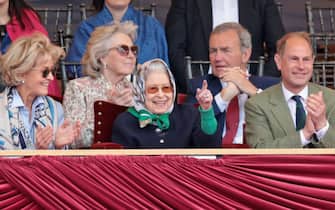 WINDSOR, ENGLAND - MAY 13: Penelope Knatchbull, Countess Mountbatten of Burma, Queen Elizabeth II and Prince Edward, Earl of Wessex celebrate the win at The Royal Windsor Horse Show at Home Park on May 13, 2022 in Windsor, England. The Royal Windsor Horse Show, which is said to be the Queen’s favourite annual event, takes place as Her Majesty celebrates 70 years of service. The 4-day event will include the “Gallop Through History” performance, which forms part of the official Platinum Jubilee celebrations. (Photo by Chris Jackson/Getty Images)