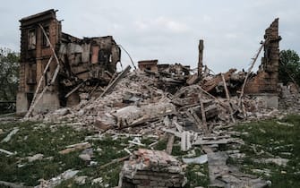 The remains of a destroyed school in which Ukrainian official say 60 people sheltering in a basement died following a Russian military strike on the village of Bilogorivka, Lugansk region, eastern Ukraine, is pictured on May 13, 2022. - On May 8, 2022, Ukranian President Volodymyr Zelensky said that sixty civilians died in the bombing of a school in eastern Ukraine's Lugansk region. Lugansk governor Sergiy Gaiday told Russian-language television station Current Time TV that 60 people died under the rubble after an "aerial bomb" struck the village school on May 7. Russia invaded Ukraine on February 22, 2022. (Photo by YASUYOSHI CHIBA / AFP) (Photo by YASUYOSHI CHIBA/AFP via Getty Images)