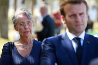 French Labour Minister Elisabeth Borne (L) and French President Emmanuel Macron are seen, on July 22, 2020 at Chambord castle, during a visit on the theme of the "learning summer camps". (Photo by Ludovic Marin / POOL / AFP) (Photo by LUDOVIC MARIN/POOL/AFP via Getty Images)