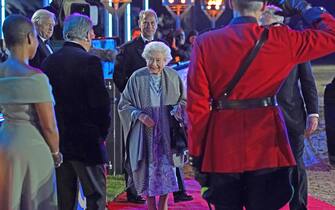 WINDSOR, ENGLAND - MAY 15: Queen Elizabeth II, with Prince Edward, Earl of Wessex, meets Alan Tichmarsh and Adjoa Andoh (L) following  the "A Gallop Through History" performance as part of the official celebrations for Queen Elizabeth II's Platinum Jubilee at the Royal Windsor Horse Show at Home Park on May 15, 2022 in Windsor, England. The Royal Windsor Horse Show continued the Platinum Jubilee celebrations with the A Gallop Through History event. Each evening, the Platinum Jubilee celebration saw over 500 horses and 1,000 performers create a 90-minute production that took the audience on a gallop through history from Elizabeth I to the present day. (Photo by Steve Parsons - WPA Pool/Getty Images)