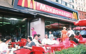 310402 27: Russians eat at McDonald's July 25, 1997 in Moscow, Russia. The only city in Russia with a rapidly growing middle class, Moscow has been revitalized by the decadence of over 300 nightclubs, as well as fast-food restaurants, shopping malls and other aspects of Western culture which entered after the fall of the USSR. (Photo by Andres Hernandez/Liaison)