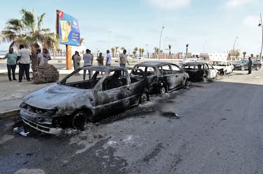 This picture taken on on May 17, 2022 in Libya's capital Tripoli shows a view of vehicles destroyed during fighting between forces loyal to the Tripoli-based Prime Minister Abdulhamid Dbeibah and rival forces of the Tobruk-based government, after the latter forces withdrew. - Fathi Bashagha, who was named premier in February by the parliament in the eastern city of Tobruk, and his ministers "have left Tripoli to preserve the security and safety of citizens," a statement from their press service said. Bashagha has been attempting to take over government institutions in Tripoli, but Prime Minister Abdulhamid Dbeibah has insisted he will only cede power to an elected successor. (Photo by Mahmud Turkia / AFP) (Photo by MAHMUD TURKIA/AFP via Getty Images)