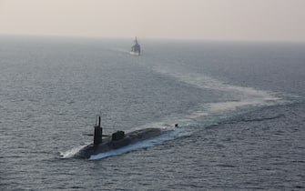 Handout photo dated December 21, 2020 of The guided-missile submarine USS Georgia (SSGN 729), front, transits the Strait of Hormuz with the guided-missile cruisers USS Philippine Sea (CG 58) and USS Port Royal (CG 73), not picturedThe US Navy appears to be sending a message to Iran in the form of a guided-missile submarine equipped with tremendous firepower and possibly special operations troops. The Ohio-class guided-missile submarine USS Georgia sailed into the Persian Gulf on Monday. For the first time in eight years, the Navy announced the presence of a guided-missile submarine in the Persian Gulf. U.S. Navy photo via ABACAPRESS.COM
