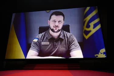 CANNES, FRANCE - MAY 17: President of Ukraine Volodymyr Zelenskyy speaks in a live link-up video during the opening ceremony for the 75th annual Cannes film festival at Palais des Festivals on May 17, 2022 in Cannes, France. (Photo by Stephane Cardinale - Corbis/Corbis via Getty Images)