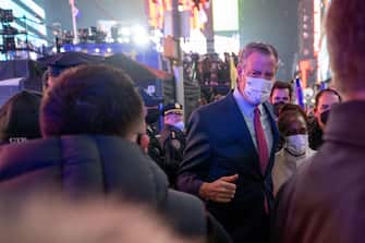 NEW YORK, NEW YORK - JANUARY 01: Outgoing New York City Mayor Bill de Blasio and his wife, Chirlane McCray, leave New Yearâ  s Eve in Times Square on January 01, 2022 in New York City. Despite a surge in COVID-19 cases New Yearâ  s Eve happened as planed but with only 15,000 vaccinated participants allowed, who were also required to be masked at all times. In an effort to increase safety, people were initially only allowed in beginning at 3 p.m. on the day of, but were let in earlier. People will also be spread out in socially-distanced pens. Last yearâ  s celebration allowed no spectators due to the coronavirus pandemic. (Photo by Alexi Rosenfeld/ Getty Images)